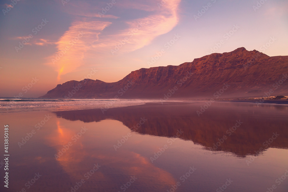 Cliffs of Caleta de Famara Beach at sunset, Lanzarote, Canary Islands, Spain.
