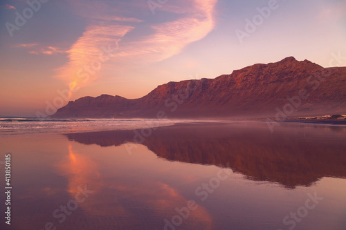Cliffs of Caleta de Famara Beach at sunset, Lanzarote, Canary Islands, Spain. © hungry_herbivore