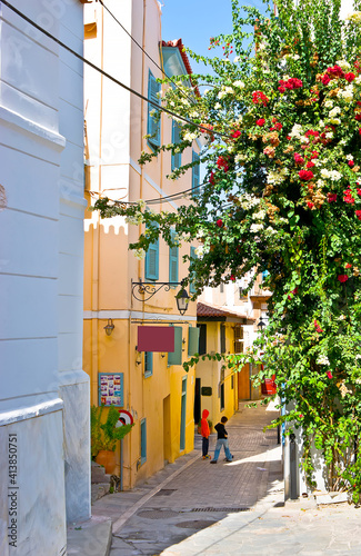 The colorful bougainvillea flowers in old town of Nafplio, Greece photo