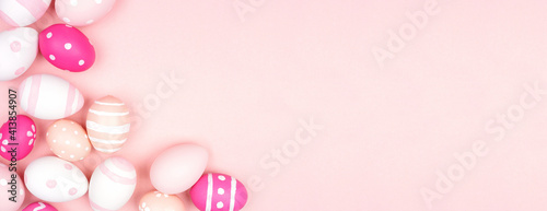 Pink and white Easter Egg corner border over a pink paper banner background. Copy space.