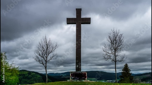 Timelapse, cross against the background of moving clouds