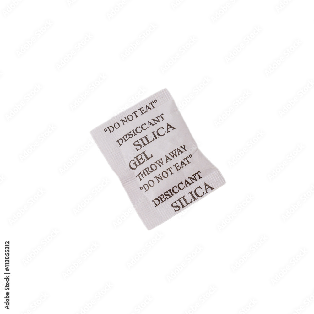 Desiccant or silica gel in white paper packaging on isolated background. Desiccant or silica gel in white paper packaging on isolated background.