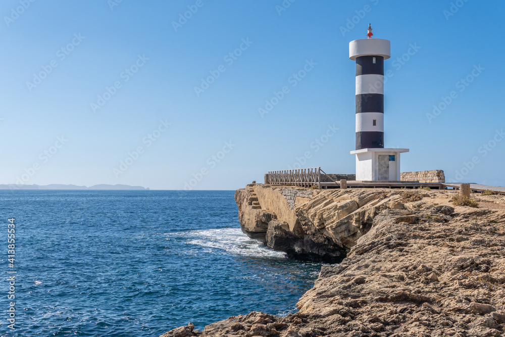 Colonia de Sant Jordi lighthouse on a sunny and winding day Colonia de Sant Jordi lighthouse on a sunny and winding day