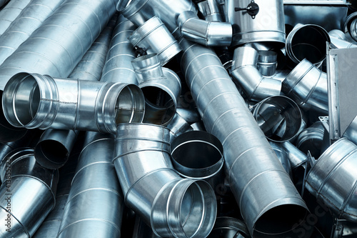 Foto Pile of pipes and parts for duct systems. Industrial ventilation