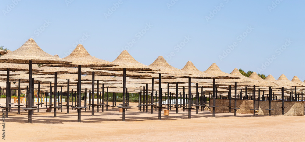 Fototapeta premium An empty beach in Egypt during the COVID 19 pandemic. The Red Sea coast, a recreation area without people.