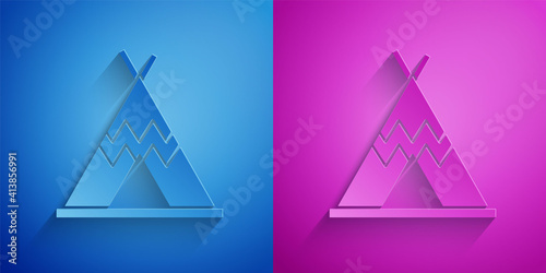 Paper cut Traditional indian teepee or wigwam icon isolated on blue and purple background. Indian tent. Paper art style. Vector.