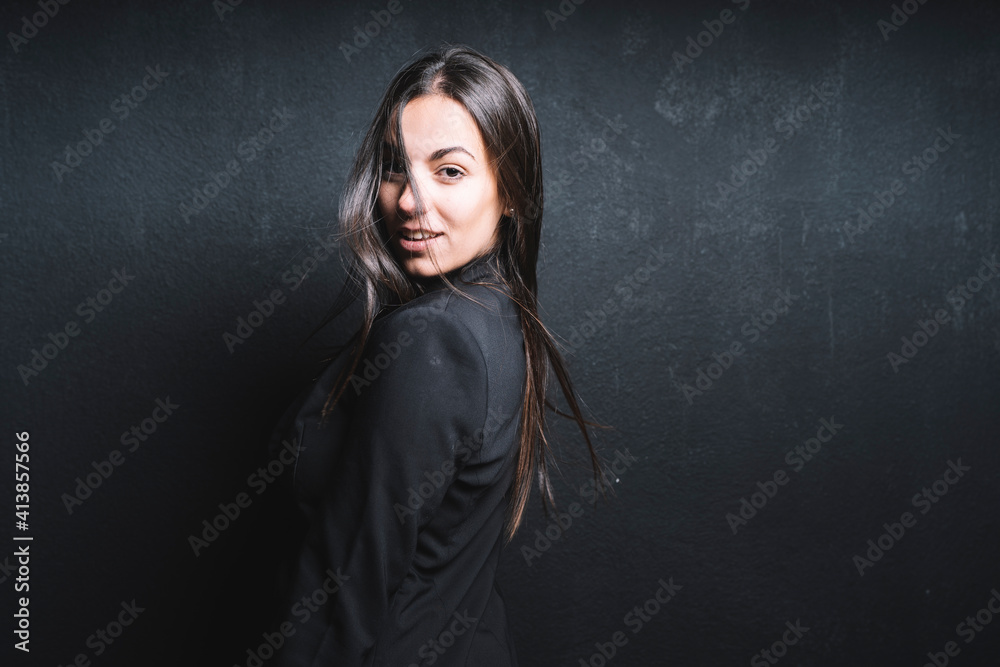 Young beautiful woman posing in black background Young beautiful woman posing in black background