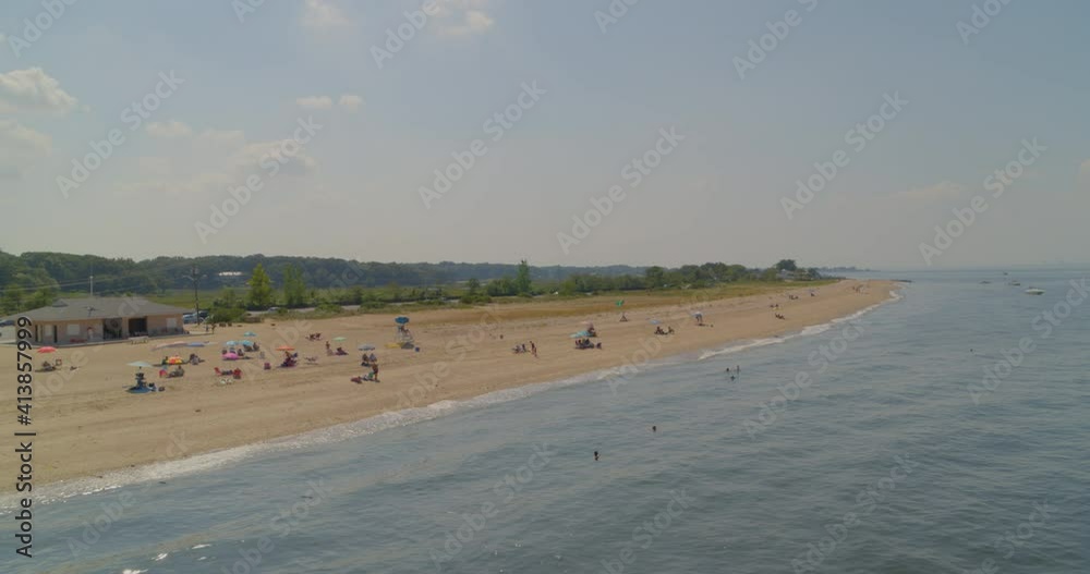 Flying Over Water and Towards Sandy Beach Shore on a Sunny Day in Long Island Flying Over Water and Towards Sandy Beach Shore on a Sunny Day in Long Island