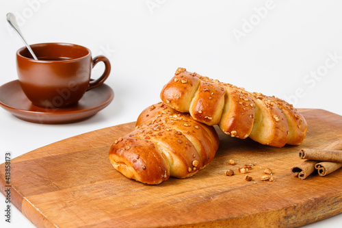 Two croissants on a wooden board