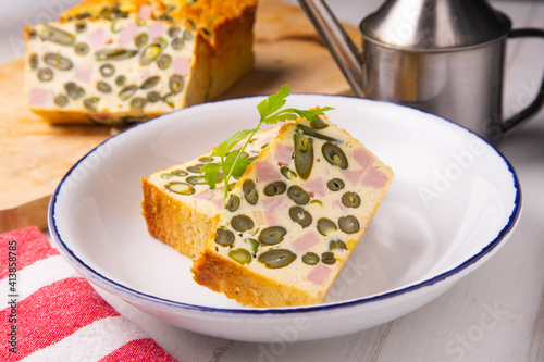 Vegetable pudding with green beans and ham.