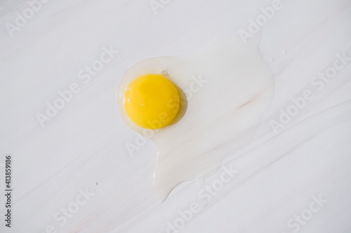 quail egg without shell on the marble background food photo hard light photo