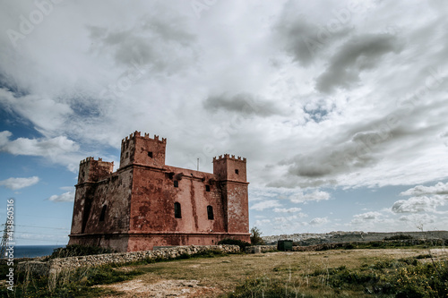 The medieval Red Tower on Malta stands guard over the Atlantic Ocean photo