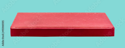 side of red book isolated on green background, high resolution image