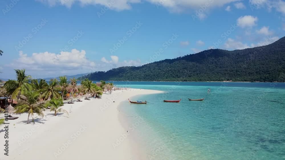 Aerial Top View on Beautiful Blue Ocean Beach with White Sand, Palms, Resort Buildings and Long tail Boats. Drone Shot of Landscape with Sea Water at Tropical Island. Birds Eye View of Empty Beach Aerial Top View on Beautiful Blue Ocean Beach with White Sand, Palms, Resort Buildings and Long tail Boats. Drone Shot of Landscape with Sea Water at Tropical Island. Birds Eye View of Empty Beach