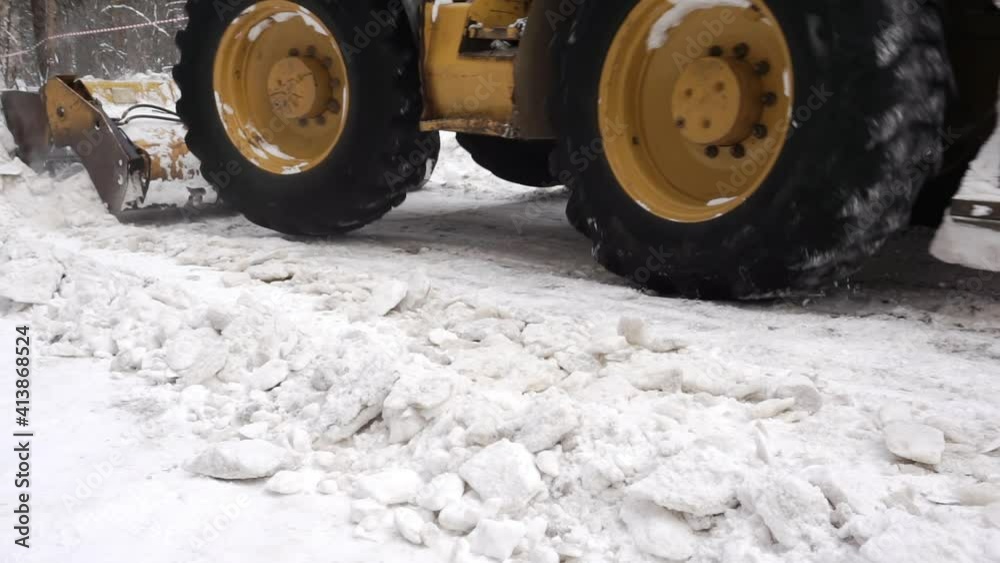 Snow removal with a tractor. Snow removal with a tractor.