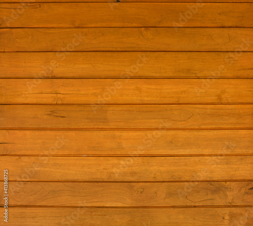 background and texture of wooden cover finishing wall made from teak wood on wall house.