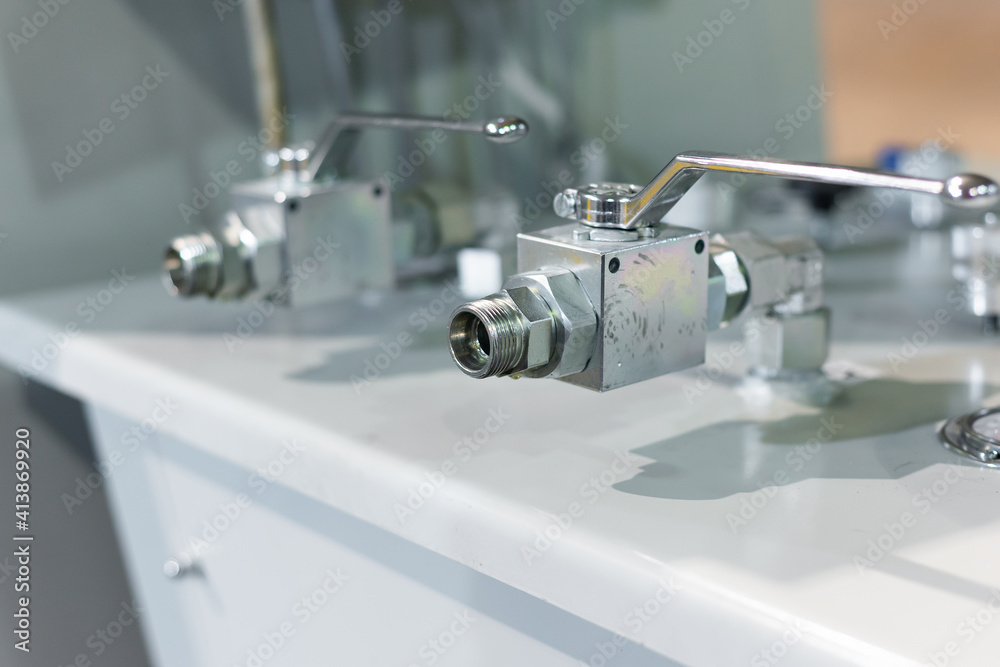 Hydraulic feed control system with tap and pressure gauge. Hydraulic feed control system with tap and pressure gauge.