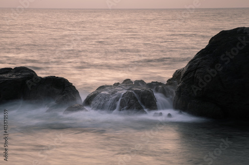 Long exposure silky smooth saltwater foam and rock formation in the evening,
