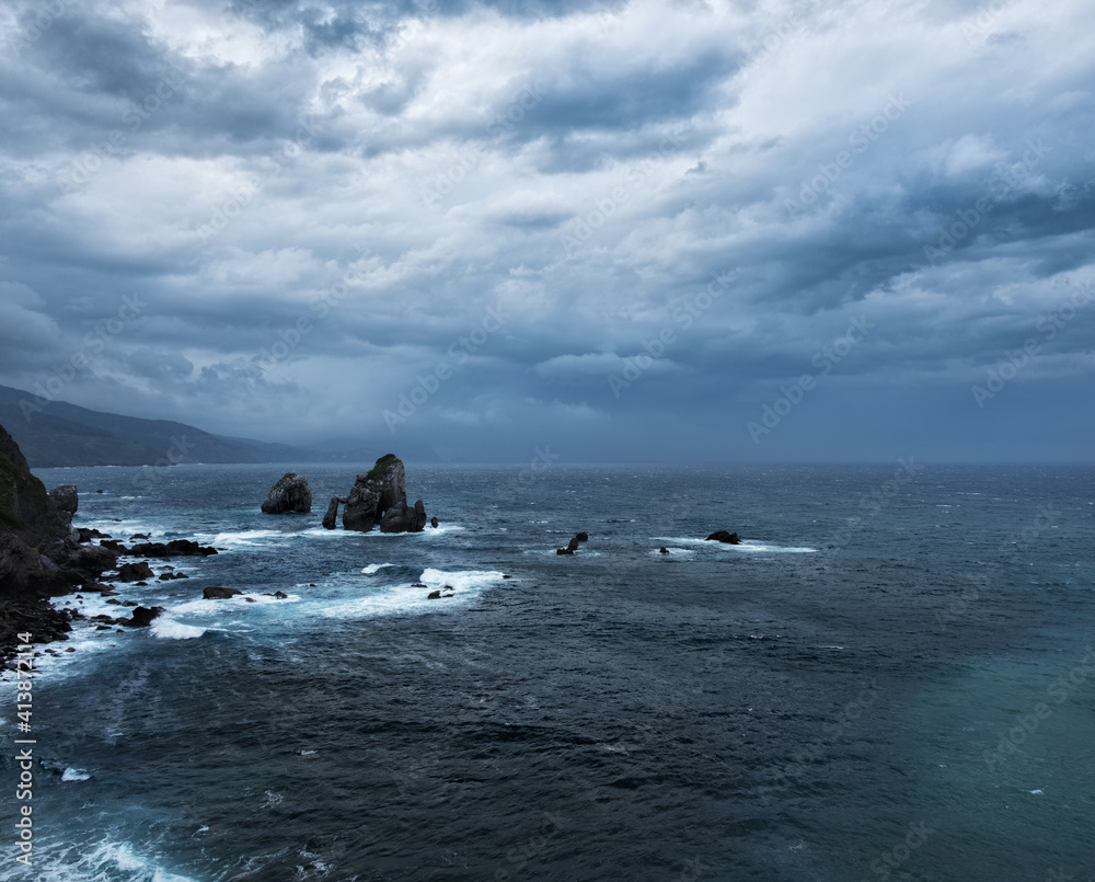 Dramatic stormy weather at rocky coast near San Juan de Gaztelugatxe, Spain. Dramatic stormy weather at rocky coast near San Juan de Gaztelugatxe, Spain.