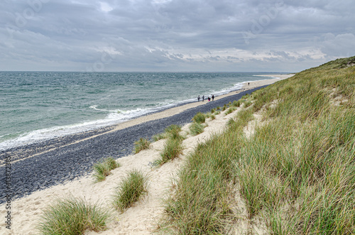 Bank revetment with basalt columns to protect the shore from the surf of the sea waves, Sylt, Germany. 