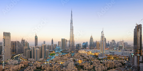 Panoramic view of Dubai skyline and Burj Khalifa under golden light