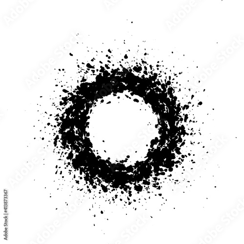 Round frame with empty space for your text. Frame made of ink spots, splashes, flecks, dots, speckles of various size. Circle shape. Black and white abstract background.