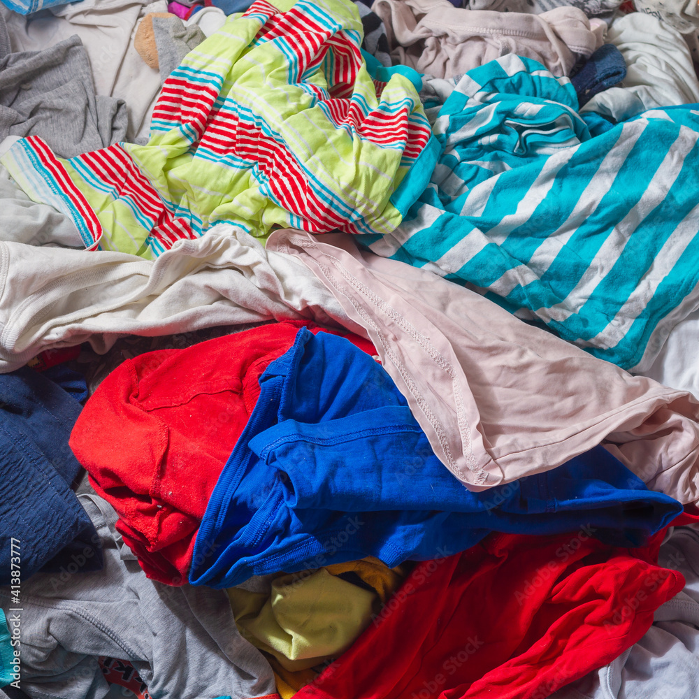 A pile of colorful crumpled underwear and clothes after washing