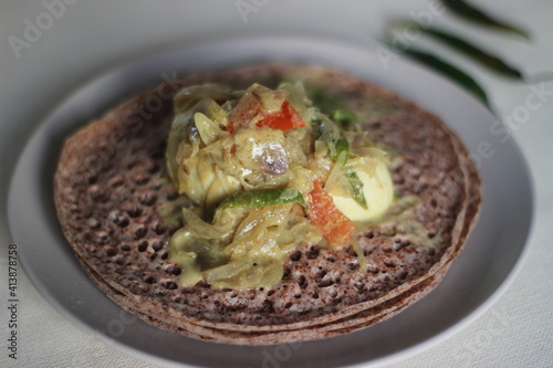 Hoppers made of finger millet served with egg stew prepared in Kerala style photo