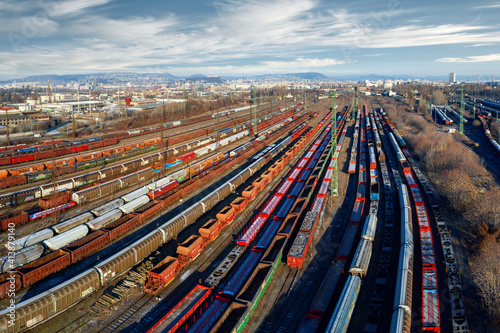 marshalling yard for railway cargo trains in Budapest. This is on Ferencvaros district. Aerial photo about lot empty and full trains.