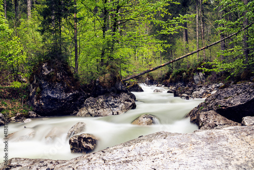 Serene and calm alpen creek. Long exposure photograp photo