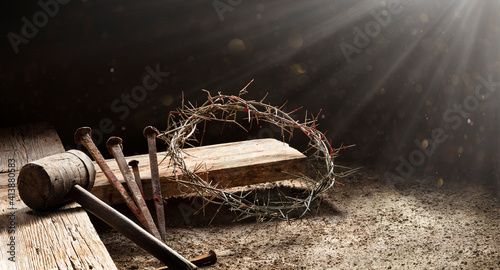 Fotografia Passion Of Jesus  - Wooden Cross With Crown Of Thorns Hammer And Bloody Spikes