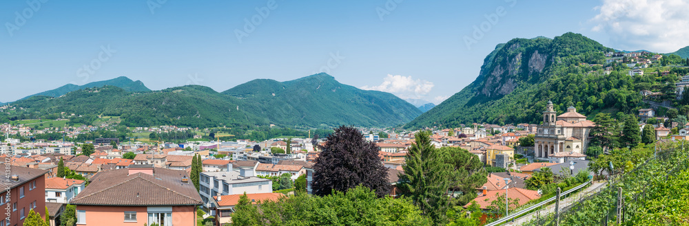 Panoramic aerial view of a Swiss city. Mendrisio with to the right the church of Saints Cosmas and Damian, Switzerland