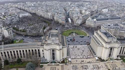 Cinematic aerial view of Gardens of the Trocadero museum around Paris streets in France feat. business district skyscrapers in the city skyline in HD and 4K resolution  photo
