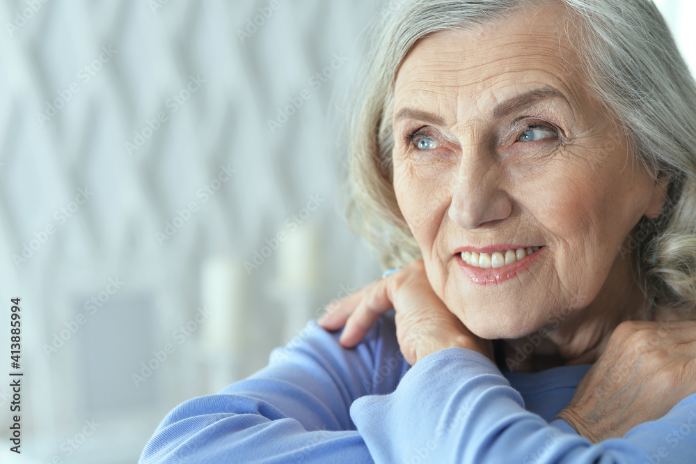 Fototapeta premium portrait of beautiful senior woman posing at home