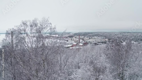 Lahti Finland. Drone video. Flight View of the city, residential buildings and streets in the snow. Day is cloudy photo