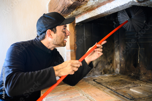 Fotografie, Tablou Young chimney sweep at work