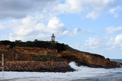 Old small lighthouse on the cliff, Tipaza, Algeria photo
