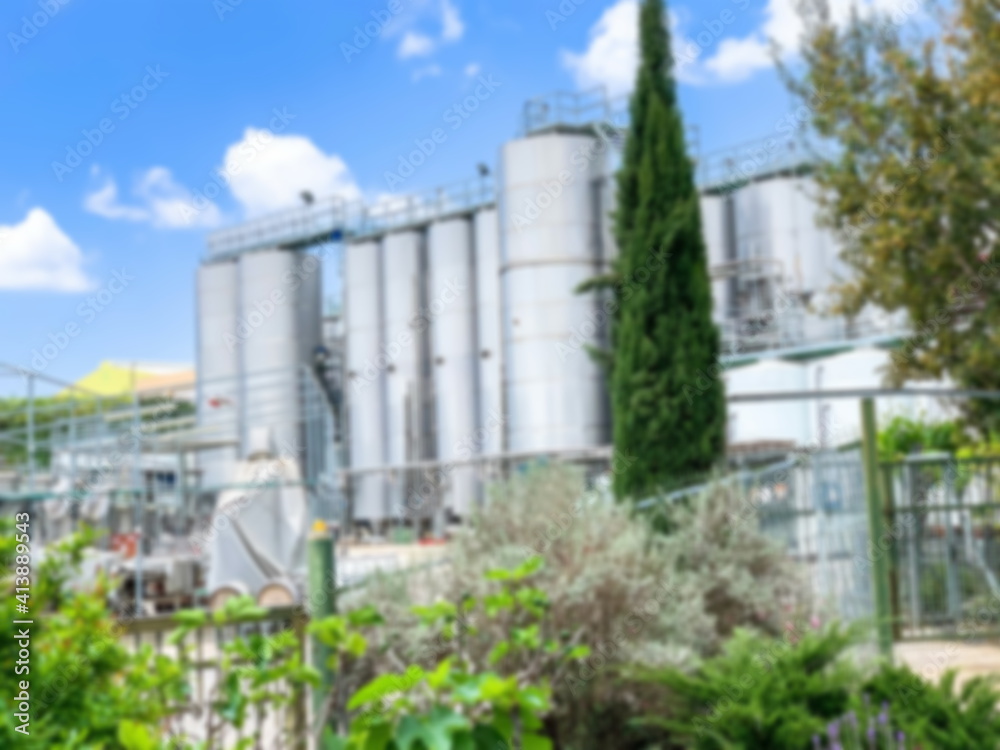 Fototapeta premium General blurred view of a modern winery with stainless steel barrels for wine fermentation
