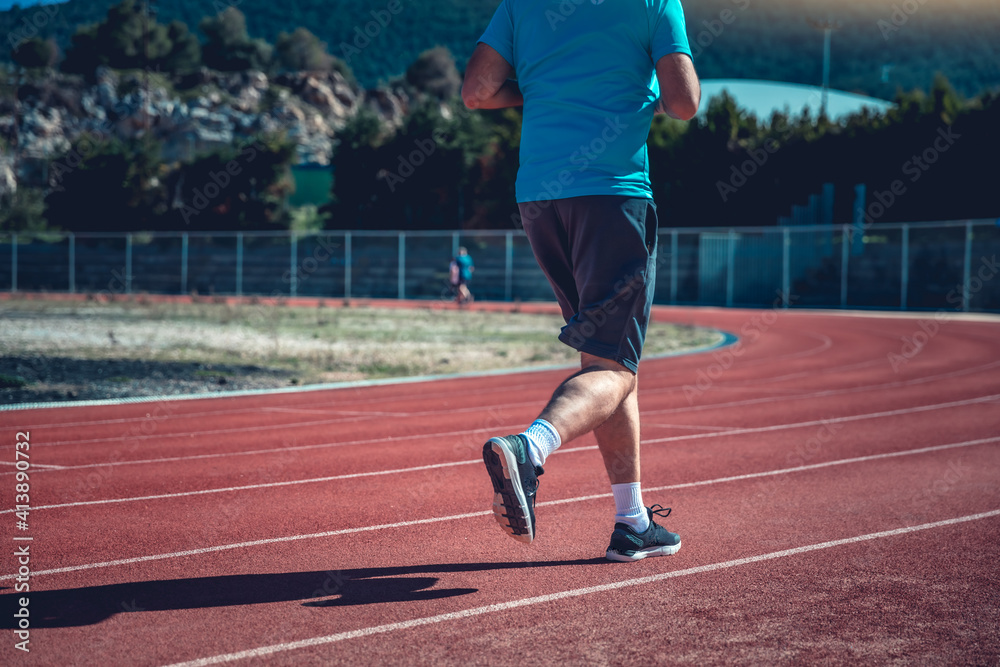 Fototapeta premium Person running on the track