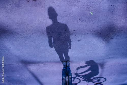 Abstract urban scene of cyclist and pedestrian in Rio downtown photo