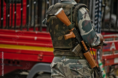 Soldier with machine gun and camouflage uniform