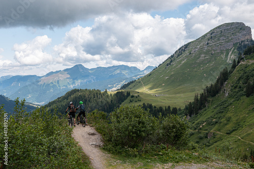 Two mountain bikers enjoying the view of the mountains, Pointe de nyon, France