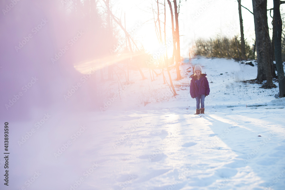 Full length of girl standing on snow covered field Full length of girl standing on snow covered field