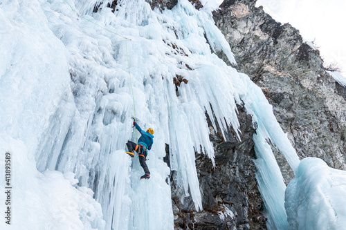 Ice climbing on frozen waterfall, Cogne, Aosta Valley, Italy