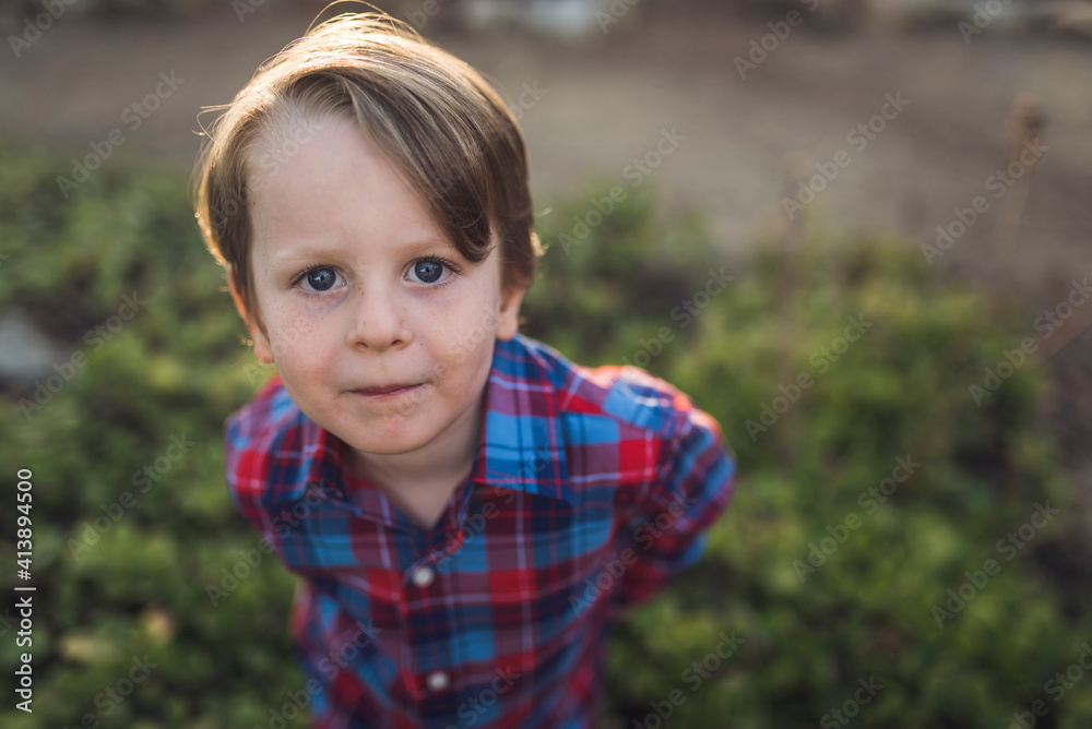 Portrait of confident boy standing at park Portrait of confident boy standing at park
