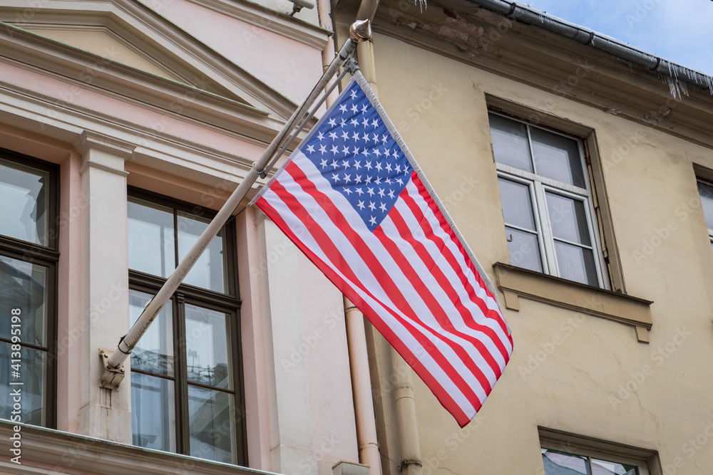 Flag of the United States of America at the wall of the building