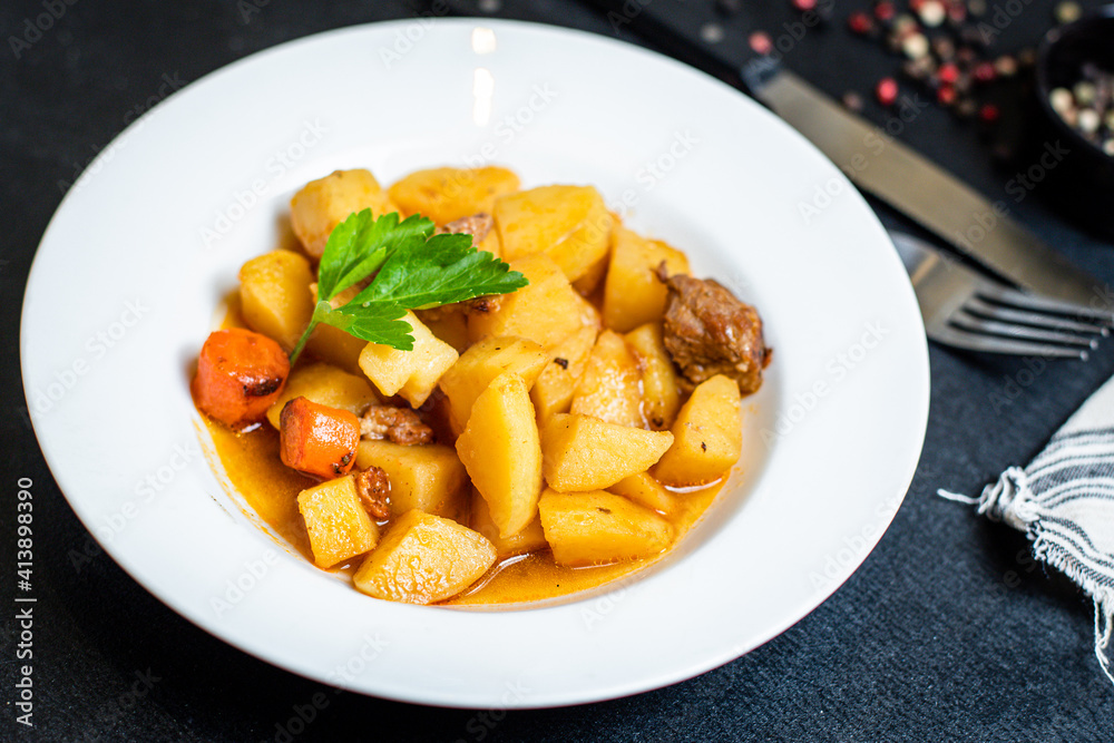 potatoe stewed goulash and meat roast second course vegetables portion on the table healthy meal snack outdoor top view copy space for text food background rustic image potatoe stewed goulash and meat roast second course vegetables portion on the table healthy meal snack outdoor top view copy space for text food background rustic image