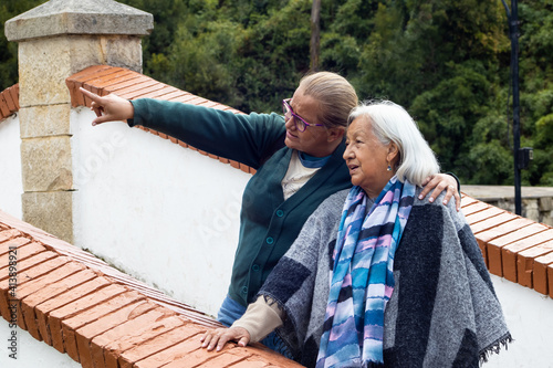 Senior mother and adult daughter traveling. The famous historic Bridge of Boyaca in Colombia. The Colombian independence Battle of Boyaca took place here on August 7, 1819. photo