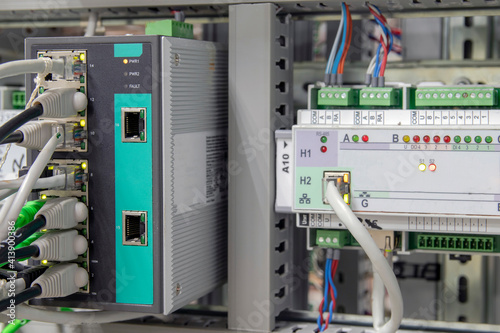 Automatic control systems close-up. Components and Controls for Process Control and Industrial Automation Solutions Fiber Optic Networking Equipment.