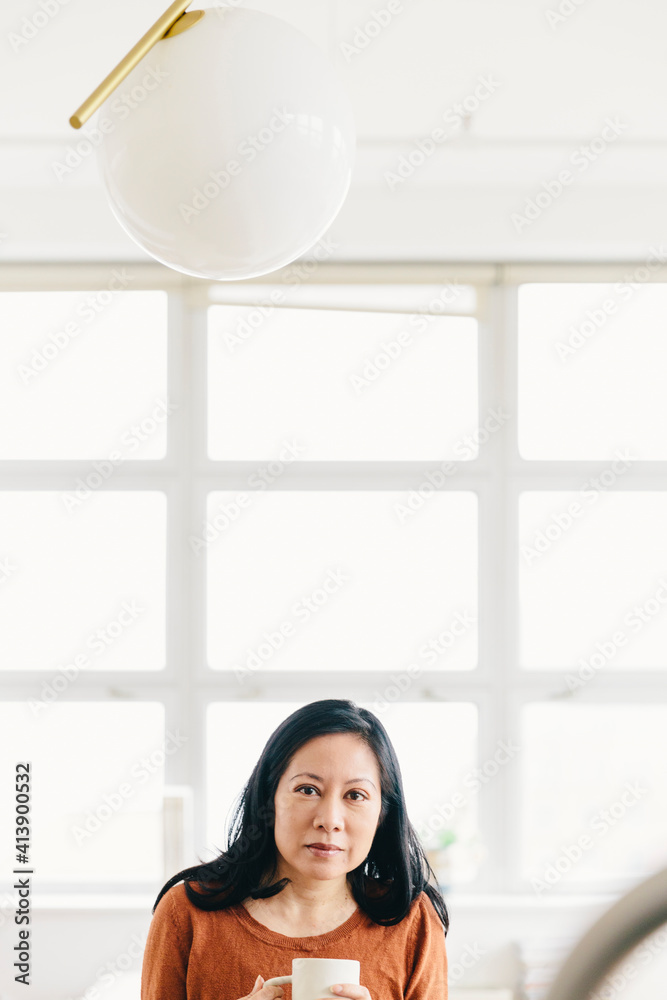 Portrait of businesswoman with coffee cup at office Portrait of businesswoman with coffee cup at office